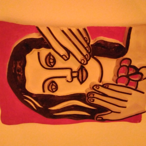 Céramique de Fernand Léger: "visage a la main sur fond rouge"