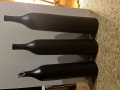 
													Trois vases bouteille noir  signes Ruelland
												