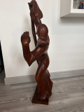 
													Sculpture en bois 64cm représentant un indigène et un serpent
												