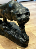 
													Tigre rugissant, épreuve en bronze patine verte, H28xL48
												