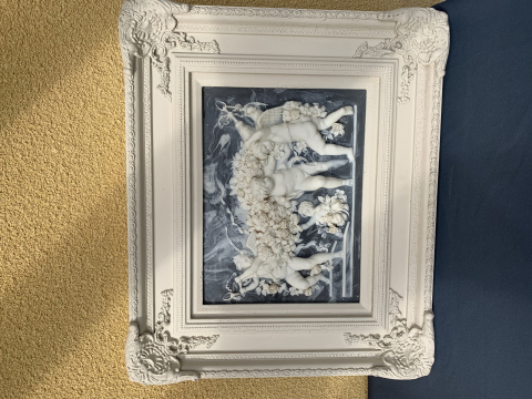 
															Angelots marbrines montes sur cadre bois
														