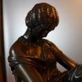 
															Horloge Sapho assise en bronze de P. Pradier
														