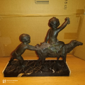 
															Bronze enfants et brebis
														